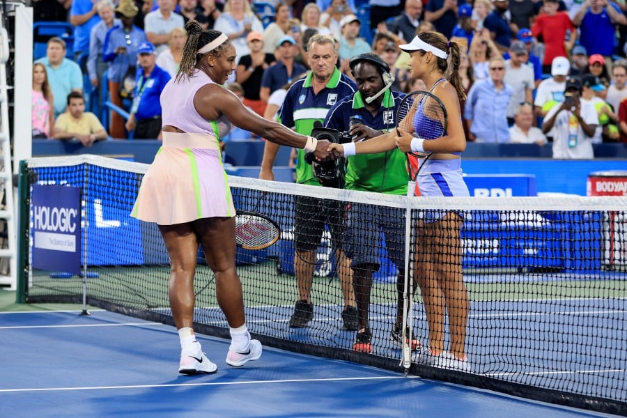 Serena Williams, left, of the United States, shakes hands with Emma Raducanu, of Britain, after their match during the Western & Southern Open tennis tournament in Mason, Ohio. - AP PIC