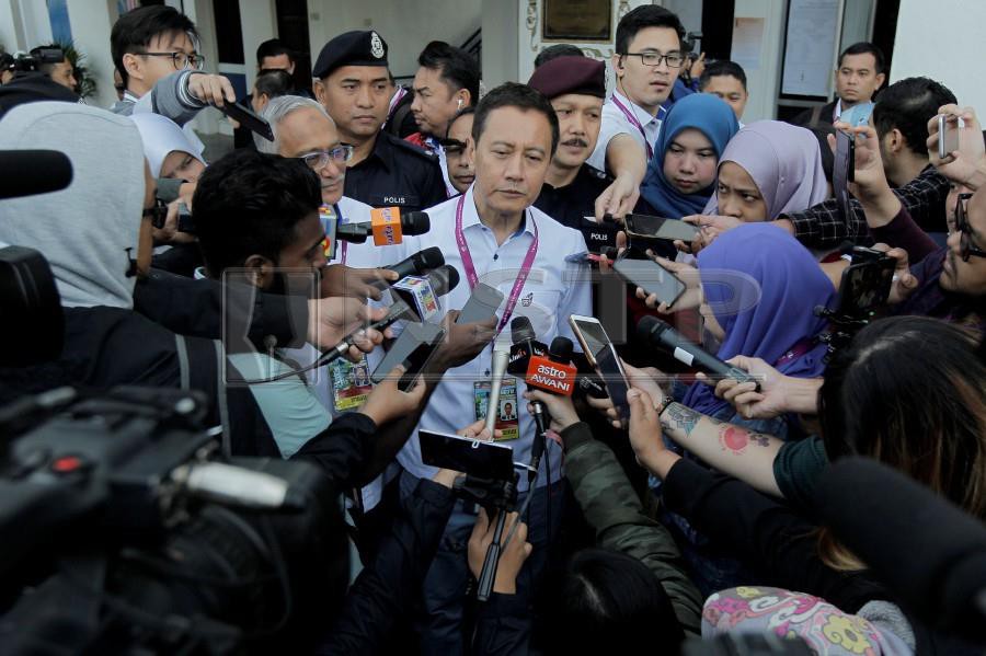 Election Commission (EC) chairman Azhar Azizan Harun speaks to reporters at the Brinchang police station. - NSTP/AIZUDDIN SAAD