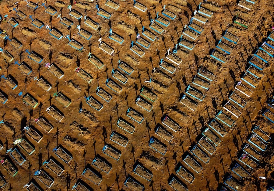 This file photo taken on June 21, 2020 shows an aerial view showing graves in the Nossa Senhora Aparecida cemetery in Manaus, Brazil. - AFP pic
