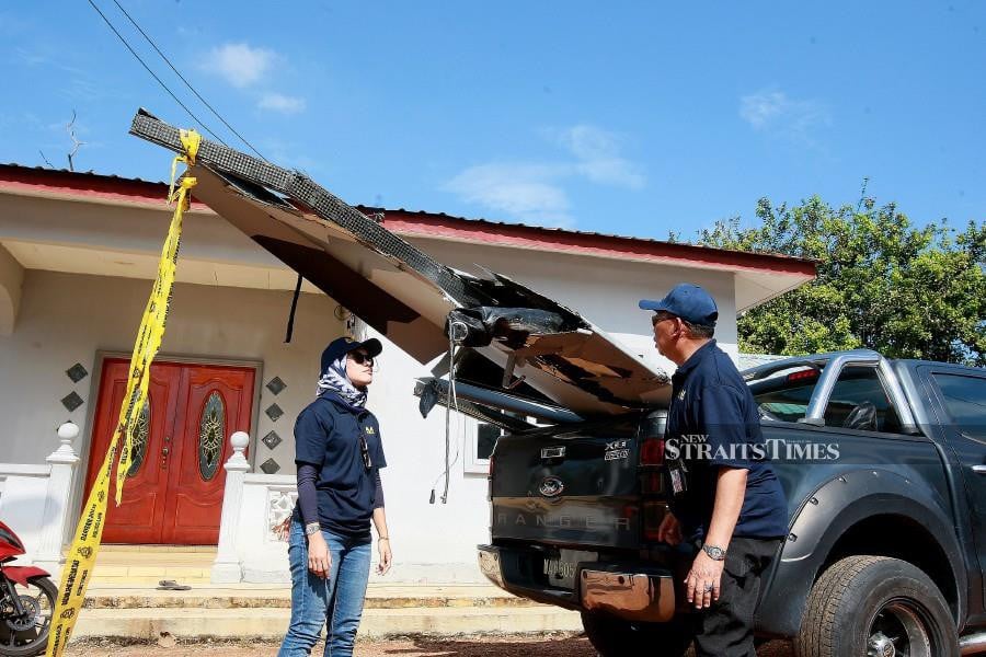 Air Accident Investigation Bureau personnel inspecting the wreckage of the aircraft in Kampung Tok Muda, Kapar, Klang. -NSTP/FAIZ ANUAR