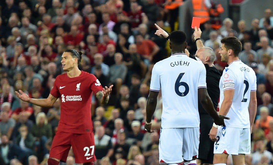 Liverpool's Darwin Nunez is shown a red card by referee Paul Tierney. -REUTERS PIC
