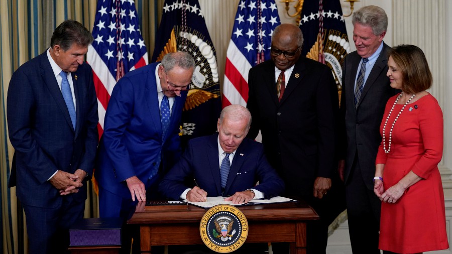 President Joe Biden signs the Democrats' landmark climate change and health care bill in the State Dining Room of the White House in Washington. - AP PIC