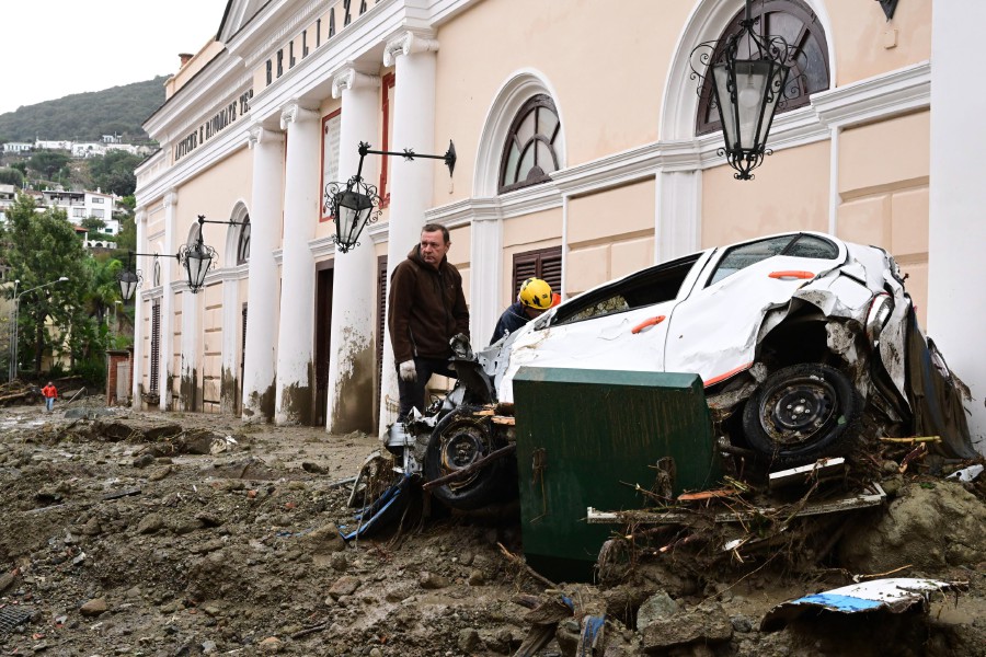 A man observes the damage caused by the landslide on the Belliazzi spa, the oldest spa in Casamicciola, Ischia island, in the Gulf of Naples, Italy. A group of people are feared to be missing after heavy rain caused a landslide from the upper part of via Celario and reached the seafront in piazza Anna Of Happy, which overwhelmed some parked cars dragging them to the sea. - EPA pic