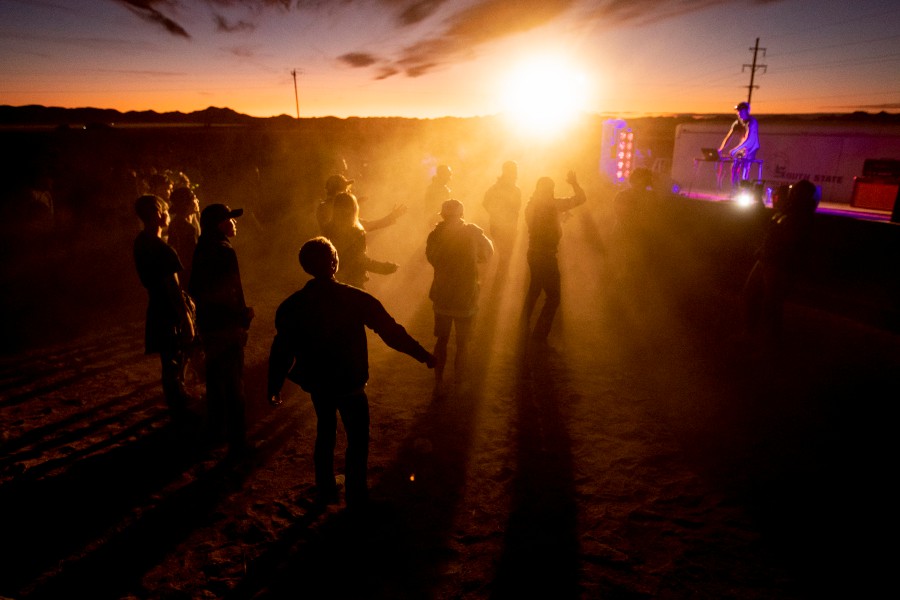 People dance during a DJ set at 'Alienstock' in Rachel, Nevada, USA. -- EPA photo