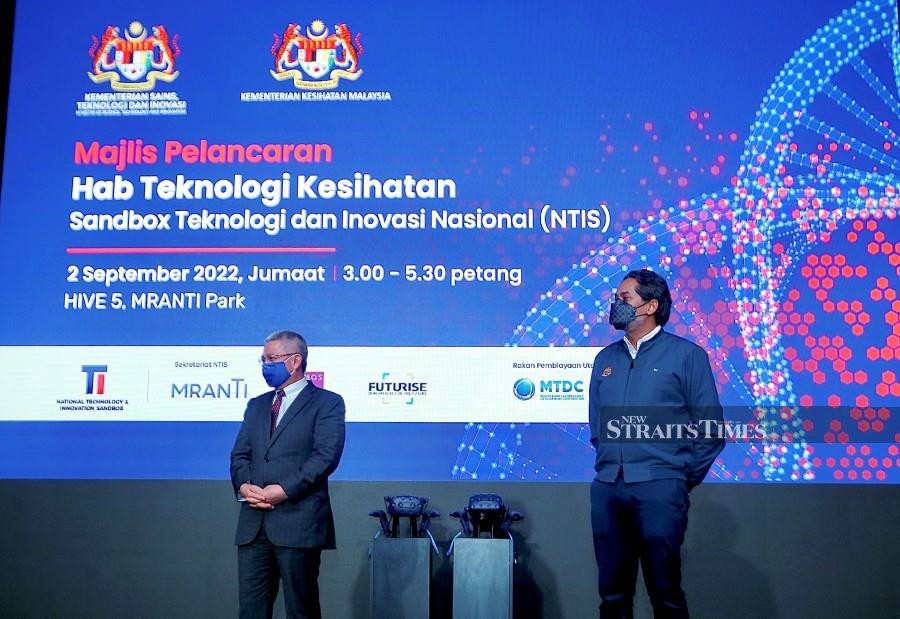 Health Minister Khairy Jamaluddin with Science, Technology and Innovation Minister Datuk Seri Dr Adham Baba gesture during the launch of the Health Technology Hub at the Malaysian Research Accelerator for Technology and Innovation (MRANTI) Park, Bukit Jalil. -NSTP/AZHAR RAMLI
