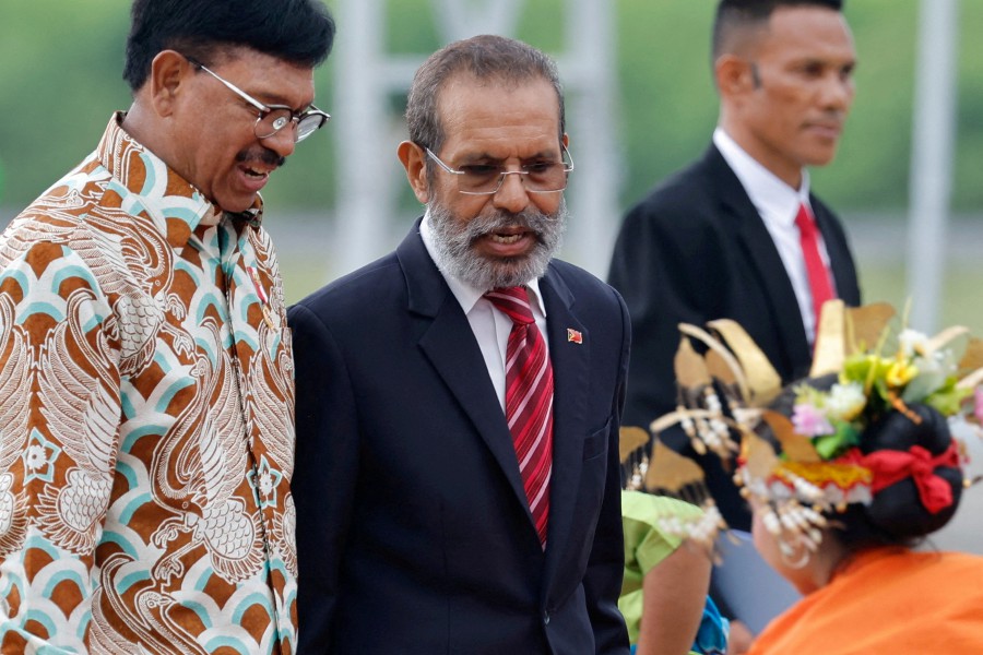  East Timor's Prime Minister Jose Maria de Vasconcelos (centre) walks with Indonesian Communications and Informatics Minister Johnny G. Plate (left), upon his arrival at the Komodo International airport, ahead of the ASEAN Summit held in Labuan Bajo, East Nusa Tenggara province, Indonesia, May 9, 2023. - REUTERS PIC