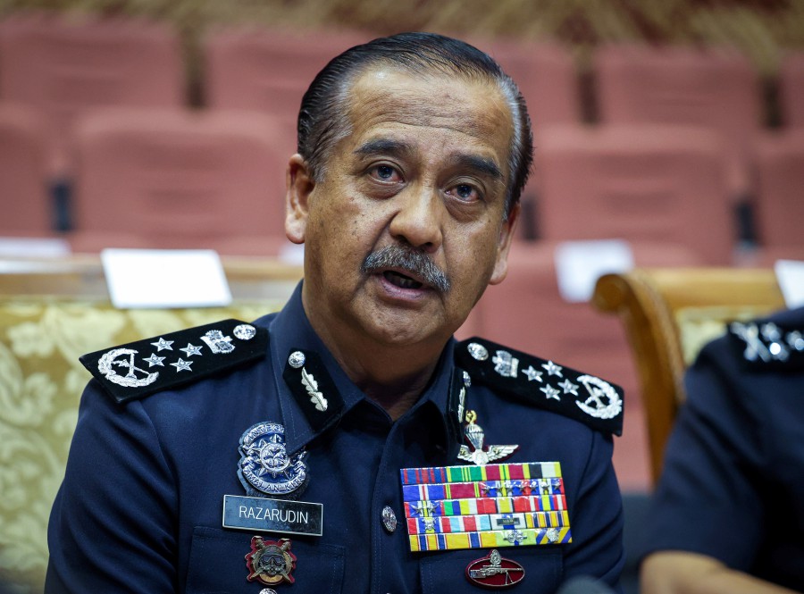 Inspector-General of Police (IGP) Tan Sri Razarudin Husain speaking to reporters after attending an event at Maktab PDRM in Cheras. - BERNAMA PIC