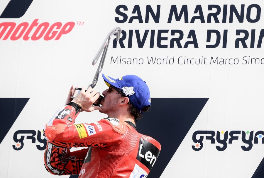 Ducati Lenovo's Italian rider Francesco Bagnaia celebrates on the podium after the San Marino MotoGP race at the Misano World Circuit Marco-Simoncelli in Misano Adriatico. - AFP PIC