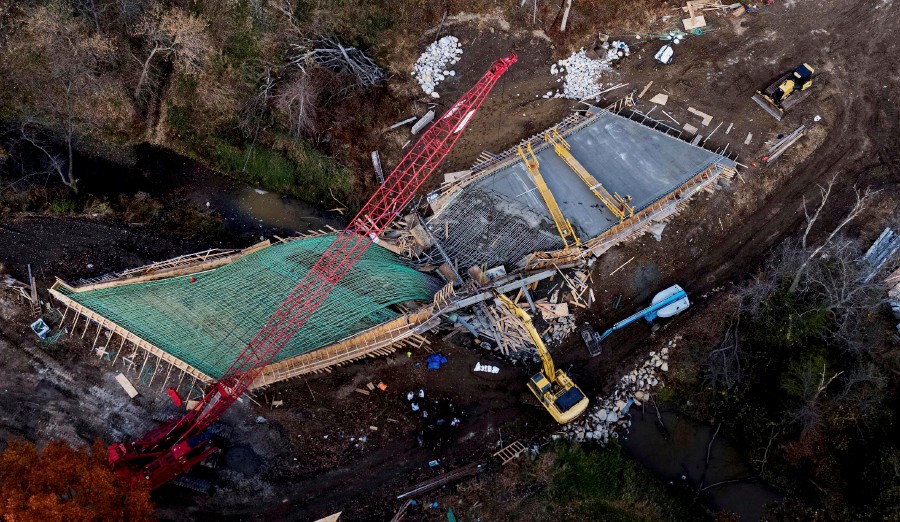Responders gather at a bridge under construction after it collapsed in rural Clay County near Kearny, Missouri. - AP PIC