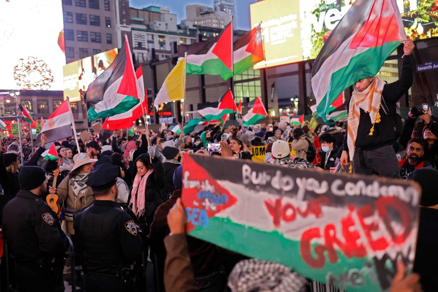 Pro-Palestine activists stop in front of Penn Station while marching in a Global Strike for Gaza on December 18, 2023 in New York City, New York.-AFP PIC