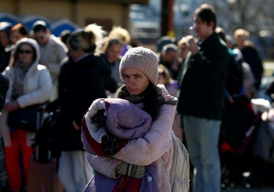 Ukrainian refugees wait to board a train back to the Ukraine outside of Przemysl Glowny train station, after fleeing the Russian invasion of Ukraine, Poland. - REUTERS PIC