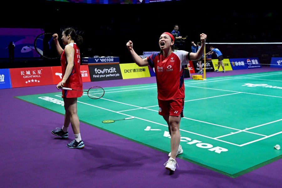 China’s Chen Qingchen and Jia Yifan celebrate after winning against Japan's Chiharu Shida and Nami Matsuyama during their women’s doubles semi-final match at the Thomas and Uber Cup badminton tournament in Chengdu, in China’s southwest Sichuan province. - A—FP PIC