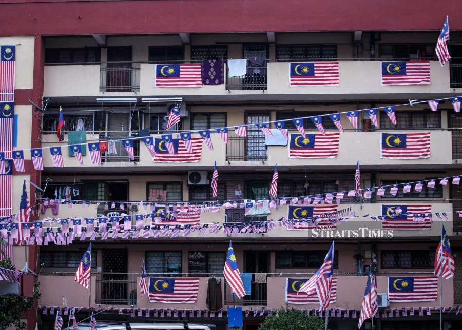 A general view of Sri Melaka flats in Cheras, decorated with Jalur Gemilang in conjunction with the 64th National Day. -NSTP/AZIAH AZMEE