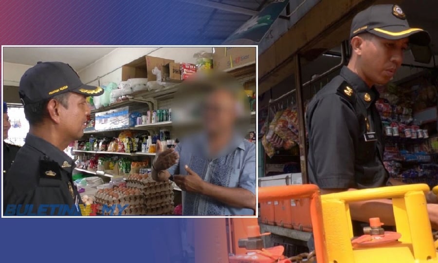 Officers speaking to a trader in Seberang Prai. - Pic courtesy of Buletin TV3. 