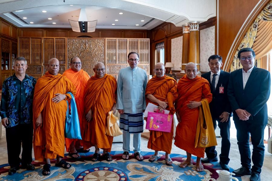Prime Minister Datuk Seri Anwar Ibrahim receives a a courtesy call from the Malaysian Siamese Buddhist Monk Association at his office in Putrajaya. - Pic credit Facebook anwaribrahimofficial. 
