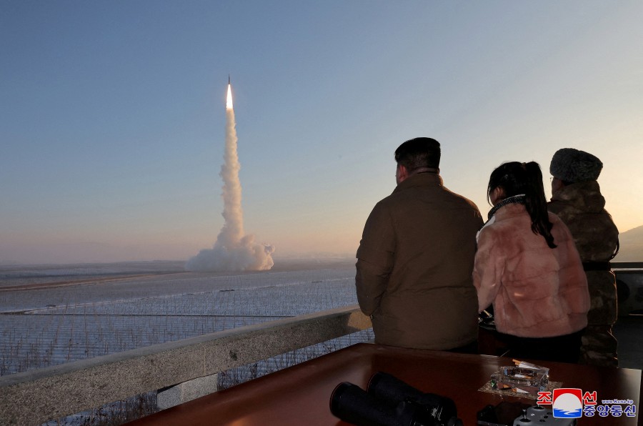 North Korean leader Kim Jong Un views the launch of a Hwasong-18 intercontinental ballistic missile during what North Korea says is a drill at an unknown location. (KCNA via REUTERS)