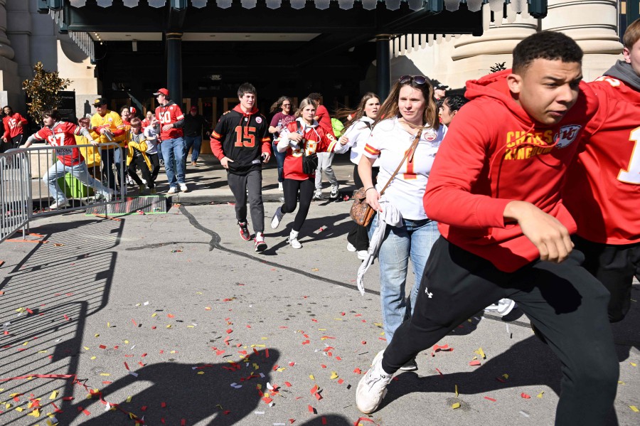 People flee after shots were fired near the Kansas City Chiefs' Super Bowl LVIII victory parade on February 14, 2024, in Kansas City, Missouri. -AFP PIC