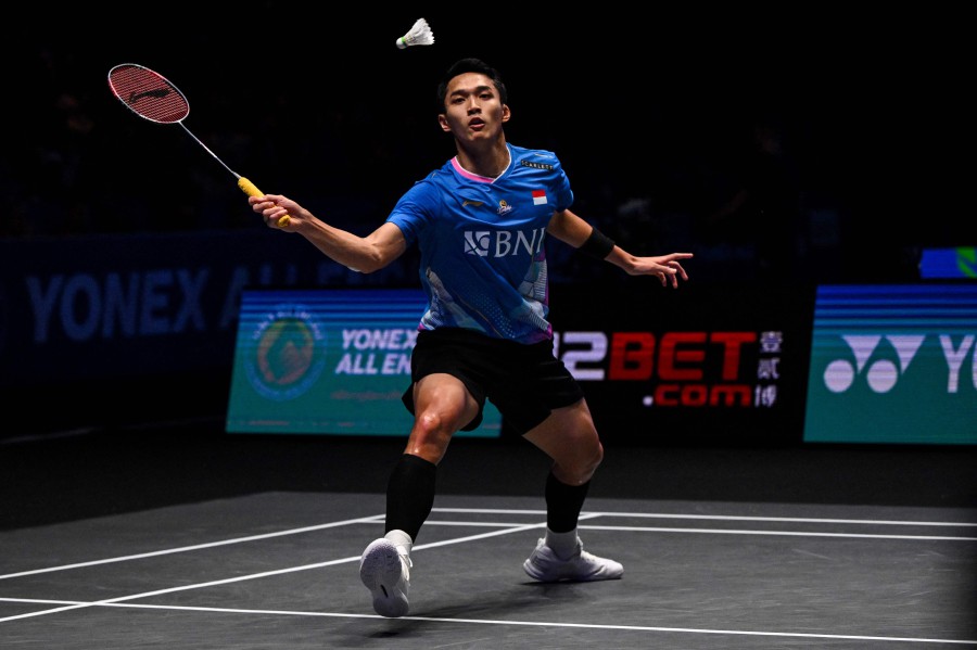 Indonesia's Jonatan Christie returns the shuttlecock to compatriot Anthony Sinisuka Ginting during the men's singles final at the All England Open Badminton Championships at the Utilita Arena in Birmingham. - AFP PIC
