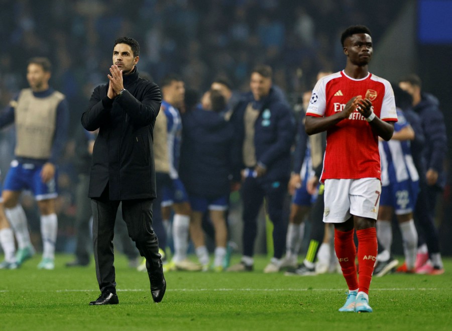 Arsenal manager Mikel Arteta and Bukayo Saka applaud fans after the match against Porto. -REUTERS PIC