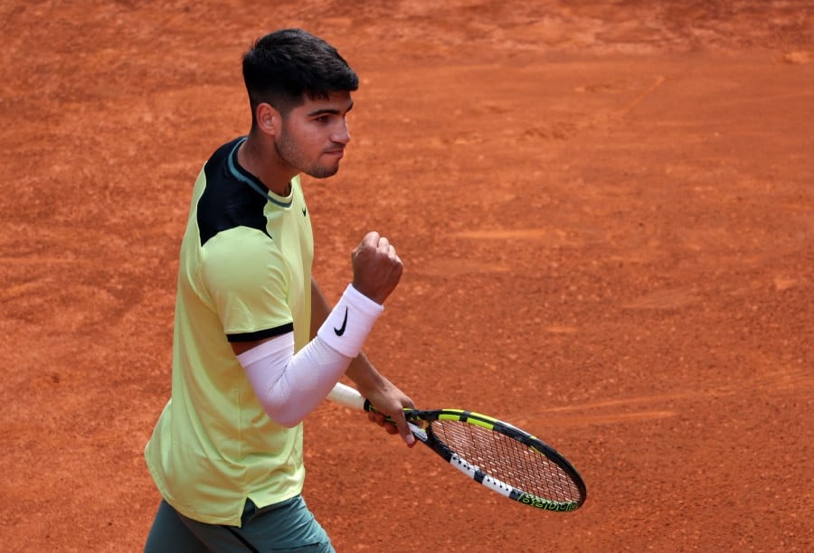Spain's Carlos Alcaraz celebrates after beating Russia's Alexander Shevchenko during the 2024 ATP Tour Madrid Open tennis tournament singles match at Caja Magica in Madrid. - AFP PIC