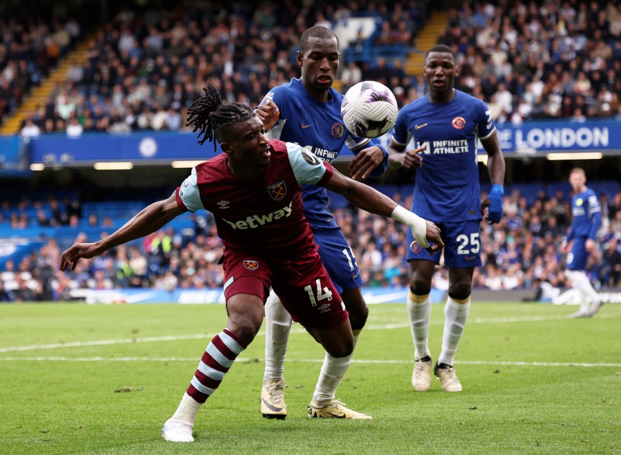 Chelsea's Nicolas Jackson in action with West Ham United's Mohammed Kudus. -- REUTERS