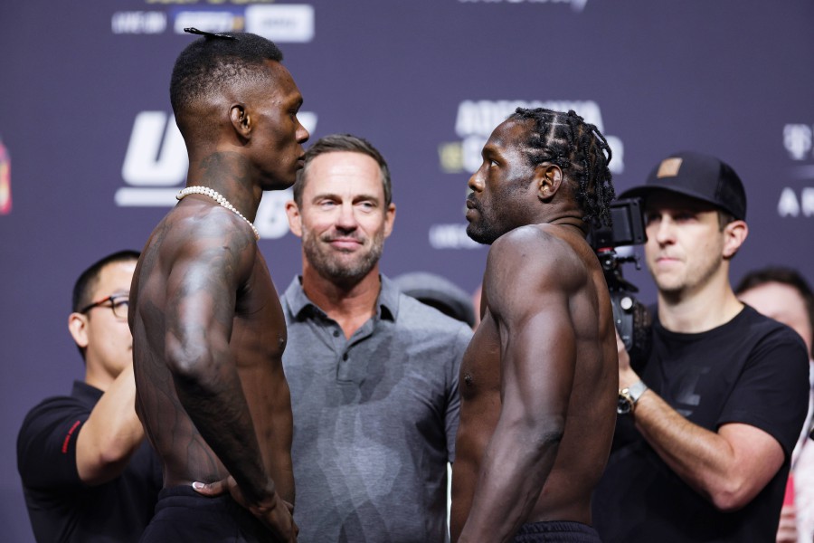  Israel Adesanya (left) and Jared Cannonier face off during the UFC 276 ceremonial weigh-in at T-Mobile Arena in Las Vegas, Nevada. --AFP PIC