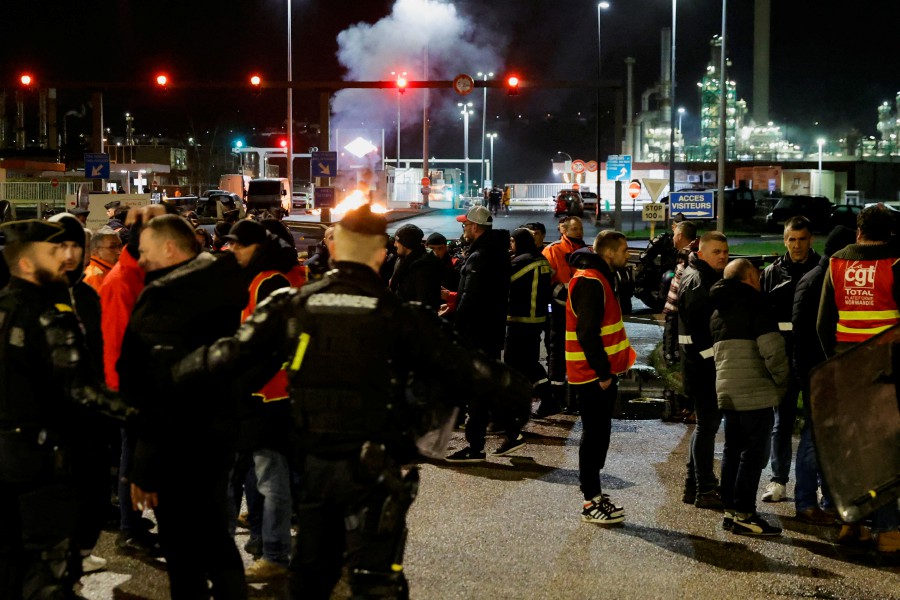 French riot police officers push back energy workers on strike as they gather in front of the TotalEnergies refinery to protest against the French government's pensions reform, in Gonfreville-L’Orcher near Le Havre, France. - REUTERS PIC