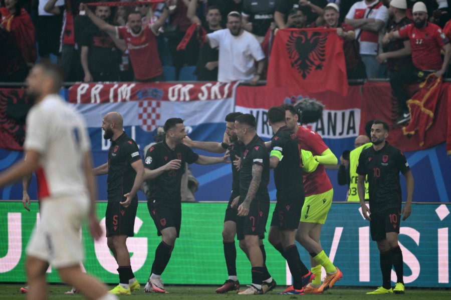 Albania's midfielder Klaus Gjasula celebrates with his team mates after scoring the equalising goal during the UEFA Euro 2024 Group B football match between Croatia and Albania at the Volksparkstadion in Hamburg. - AFP PIC