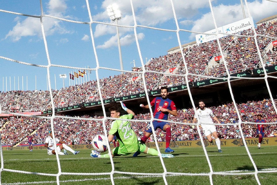Barcelona's Ilkay Gundogan scores their first goal against Real Madrid at the Estadi Olimpic Lluis Companys, Barcelona. - REUTERS PIC