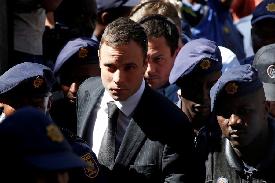 South African Olympic and Paralympic sprinter Oscar Pistorius arrives at the North Gauteng High Court in Pretoria October 21, 2014. -REUTERS PIC