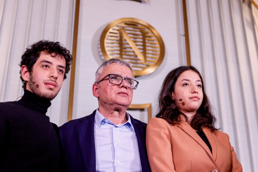 The husband and children of this year's winner of the Nobel Peace Prize, Ali, Taghi and Kiana Rahmani are pictured after the press conference at the Nobel Institute in Oslo, Norway. - REUTERS PIC