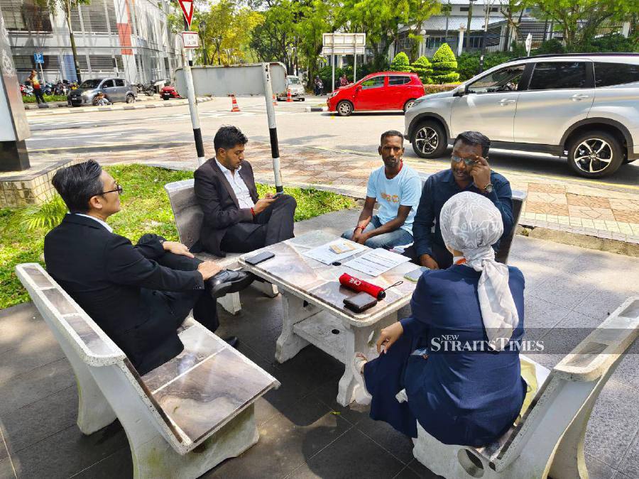 Malaysia-Singapore Workers Task Force chairman S. Dayalan (2nd left) and lawyer Dinesh Muthal (2n-right) speaking to the media. - NSTP/Hadi Solehim