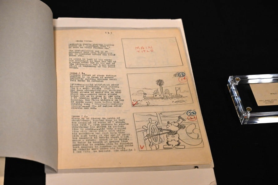  The original 1928 script for Disney's "Steamboat Willie," the first cartoon to star Mickey Mouse, is displayed during a media tour of the Walt Disney Archives, on June 20, 2023 at the Disney Studio lot, in Burbank, California. - AFP PIC
