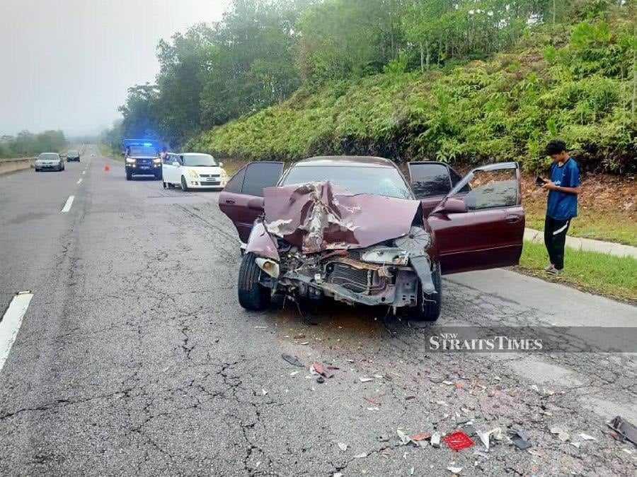 The Proton Wira that crashed into a moving lorry at Km37 of the Central Spine Road near Lipis today. -Pix courtesy of Lipis police