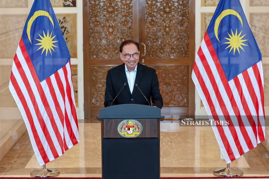 This Dec 12 pic shows Prime Minister Datuk Seri Anwar Ibrahim announcing the cabinet reshuffle Bangunan Perdana Putra in Putrajaya. - BERNAMA PIC