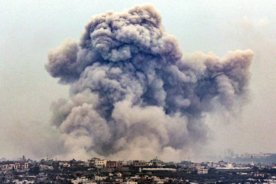  Smoke billows over Khan Yunis from Rafah in the southern Gaza strip. - AFP PIC
