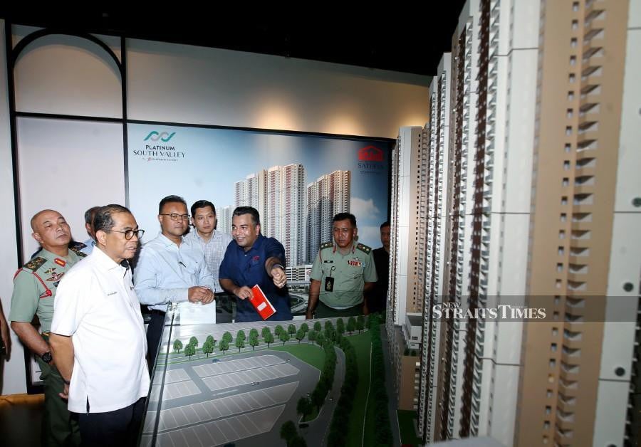 Defence Minister Datuk Seri Mohamed Khaled Nordin views a replica of the SASaR project at PSV Sales Gallery, Sungai Besi. -NSTP/EIZAIRI SHAMSUDIN