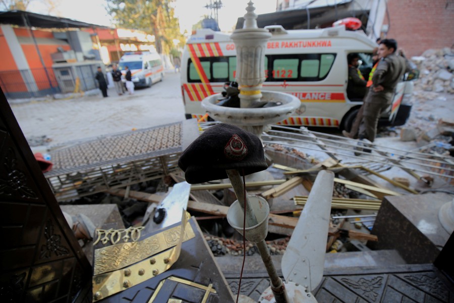 A police beret (C) among debris at the scene a day after a suicide bomb blast at a mosque in Police Lines, in Peshawar, KPK province, Pakistan. - EPA PIC