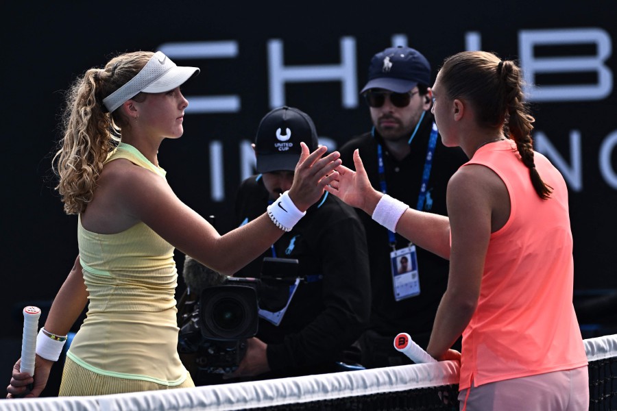 Russia's Mirra Andreeva (L) greets France's Diane Parry after winning their women's singles match on day six of the Australian Open tennis tournament in Melbourne. - AFP PIC