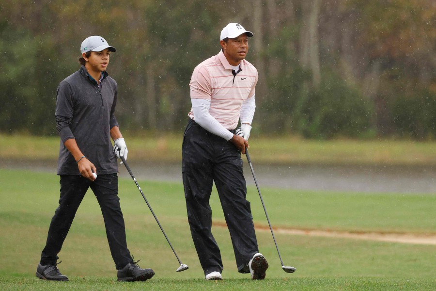  Tiger Woods of the United States and son Charlie Woods look on from the 14th hole during the first round of the PNC Championship at The Ritz-Carlton Golf Club on December 16, 2023 in Orlando, Florida. -AFP PIC