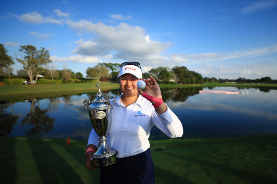 Lilia Vu of the United States poses with her ball and the trophy after winning The Annika driven by Gainbridge at Pelican at Pelican Golf Club in Belleair, Florida. - AFP PIC