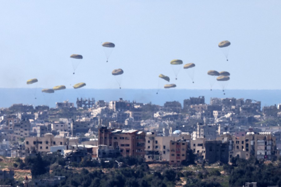 In this picture taken from Israel's southern border with the Gaza Strip shows humanitarian aid being airdropped over the Palestinian territory on March 10, 2024, amid the ongoing conflict between Israel and Hamas. -- AFP