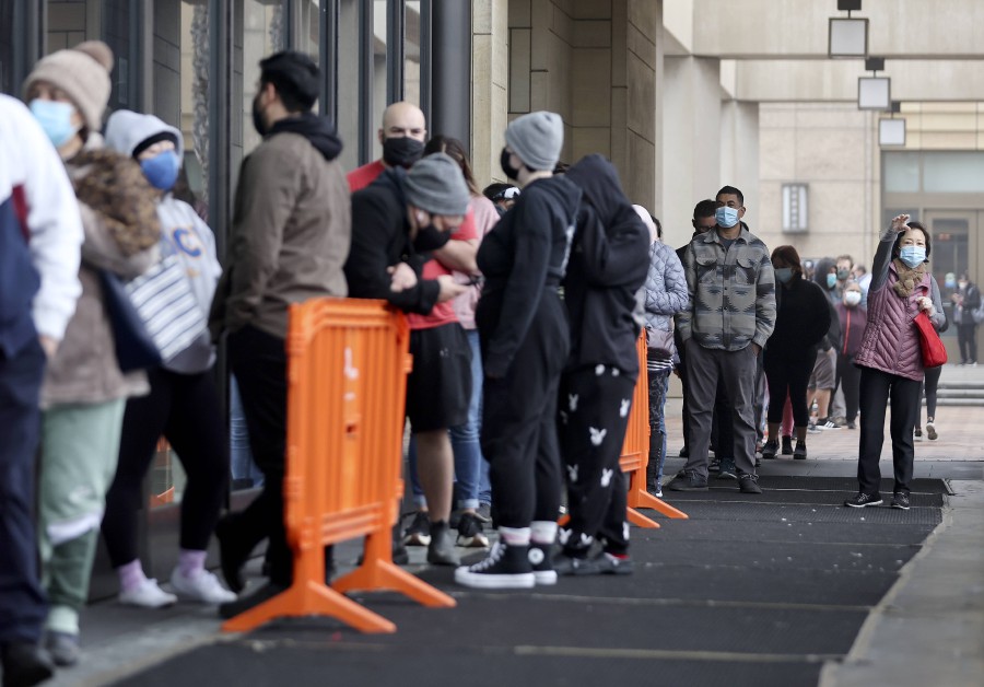 People wait in line to be tested for Covid-19 at Union Station on January 7, 2022 in Los Angeles, California. - AFP PIC