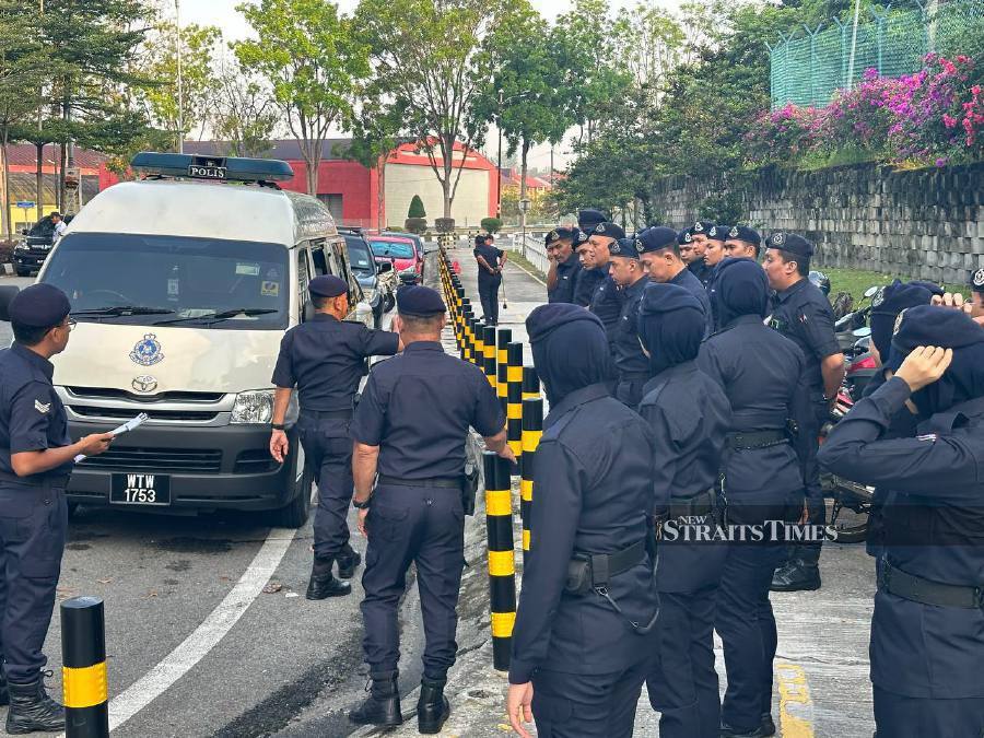 Police officers were seen at the court’s entrance early this morning. -NSTP/Amalina Kamal,