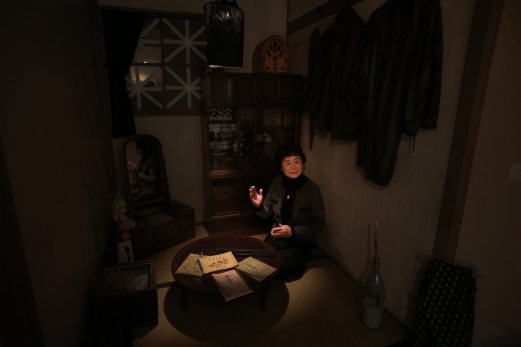  Haruyo Nihei speaks at a room depicting the situation at that time of WWII under the blackout order at the Center of the Tokyo Raids and War Damage. Nihei was only 8-years-old when the biggest attack of the war, the firebombing of central Tokyo, killed over 100,000 people and left hundreds of thousands more homeless. She fled with her family and watched as many others were burned alive. As the flames swept over her, she was sheltered by her father and many others who piled on top of them who suffocated or burned to death. AP Photo 