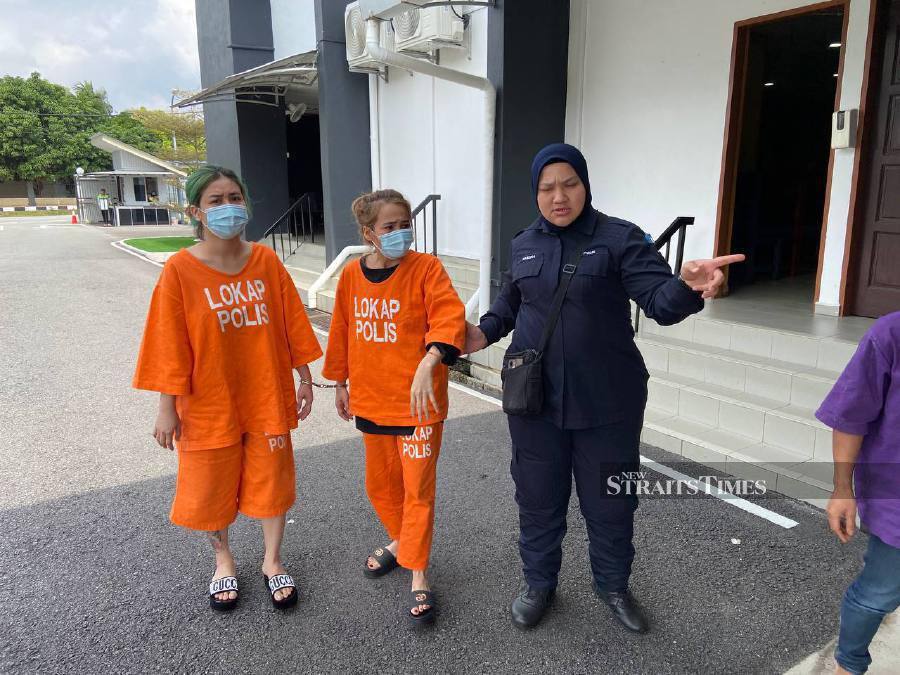 Phung Thi and Truong Bao Tran seen arriving at the Batu Pahat magistrate’s court ahead of the trial.-NSTP/Alias Abd Rani