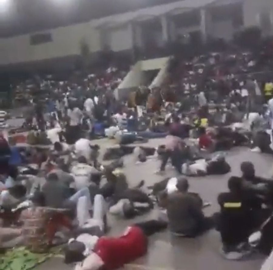 This screengrab from a viral video shows some of the stampede victims on the flood of the stadium. 