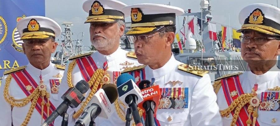 Navy chief Admiral Tan Sri Abdul Rahman Ayob (centre) speaks to reporters after today's naming and commissioning ceremony for both patrol crafts at the Tanjung Gelang naval base in Kuantan.- NSTP/Asrol Awang