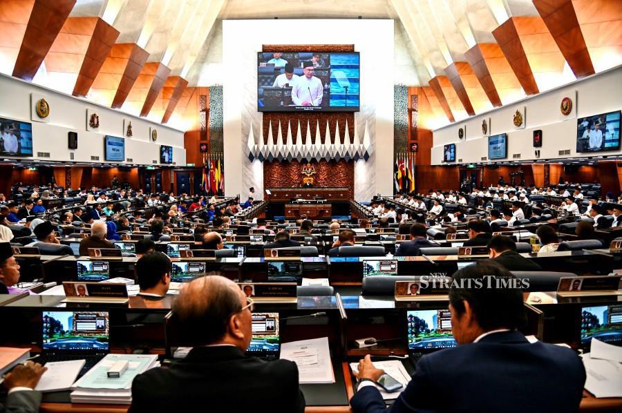 Prime Minister and Finance Minister Datuk Seri Anwar Ibrahim tabling the 2024 Budget in Dewan Rakyat today. - Pic courtesy Information Dept.