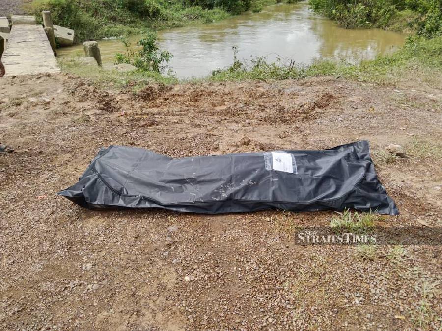 The victim was fishing at a river in Kampung Bukit Gading here when he was believed to have slipped and fallen into the river. - Pic courtesy of PDRM